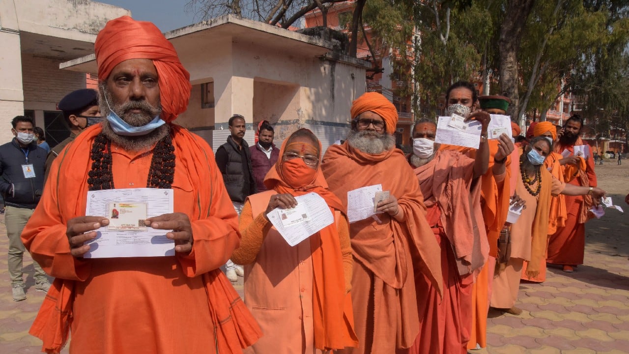 Hindu holy men line up to cast their votes for the Uttarakhand state assembly elections in Haridwar on February 14. (Image: AP)