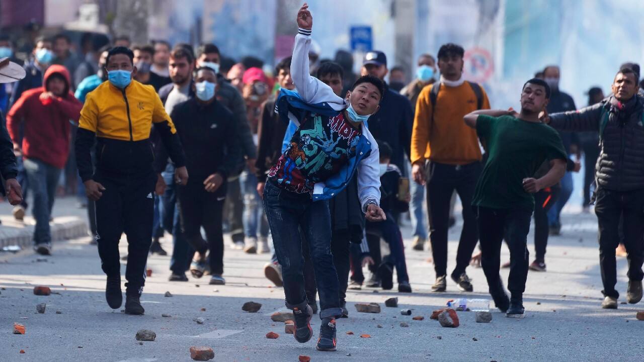 Nepalese protesters opposing a proposed U.S. half billion dollars grant for Nepal clash with police outside the parliament in Kathmandu, Nepal, February 16. The proposal was scheduled to be presented in the parliament on February 16 for approval but was postponed because of disagreement between the political parties. There has been growing opposition to the grant, mainly led by Communist parties. The money is meant to be used for the construction of power transmission lines and improvement of roads in the Himalayan nation, but the parties allege it comes with conditions that are not acceptable for the country. (Image: AP)