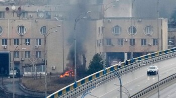 Smoke and flame rise near a military building after an apparent Russian strike in Kyiv, Ukraine. (Image: AP)