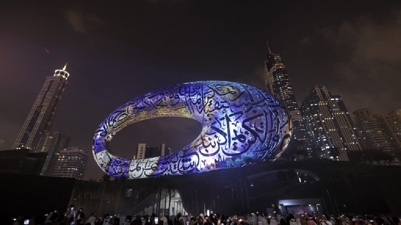 The museum is a seven-storey hollow silver ellipse decorated with Arabic calligraphy quotes from Dubai's ruler. It takes pride of place on Sheikh Zayed Road, the city's main highway. (Image: AFP)