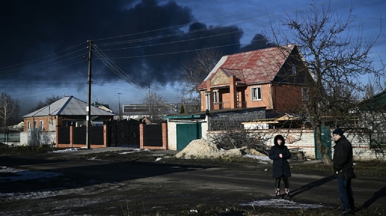 Smoke bellows from a house in Eastern Ukraine after being hit by shells fired by Russia (Image: AFP)