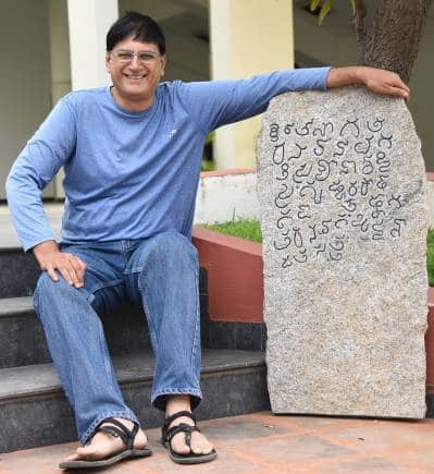 Udaya Kumar P.L. with a replica of a 900CE inscription stone. The inscription is the first written record of the name Bengaluru (4th line first four characters) within it. (Photo credit: Venkatesan Peevee Perumal)