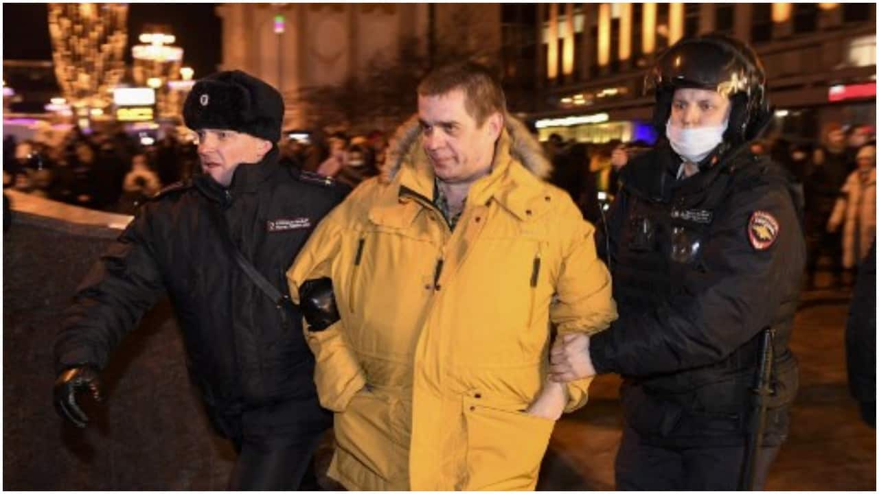 Police officers detain a demonstrator during a protest against Russia's invasion of Ukraine in Mosco