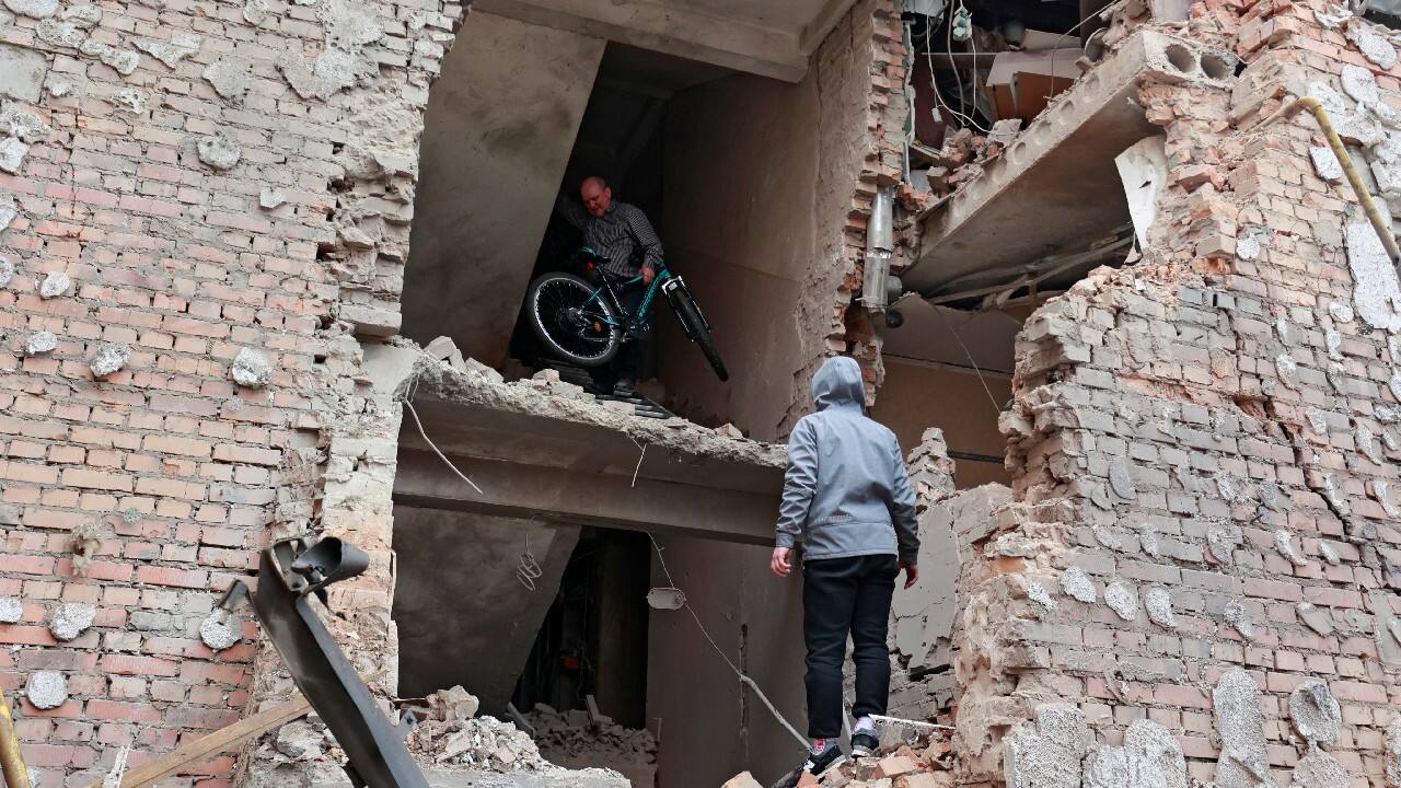 A man carries a bicycle out of a residential building destroyed by recent shelling, as Russia's invasion of Ukraine continues, in the city of Irpin in the Kyiv region, Ukraine March 2. (Image: Reuters) A man carries a bicycle out of a residential building destroyed by recent shelling, as Russia's invasion of Ukraine continues, in the city of Irpin in the Kyiv region, Ukraine March 2. (Image: Reuters)