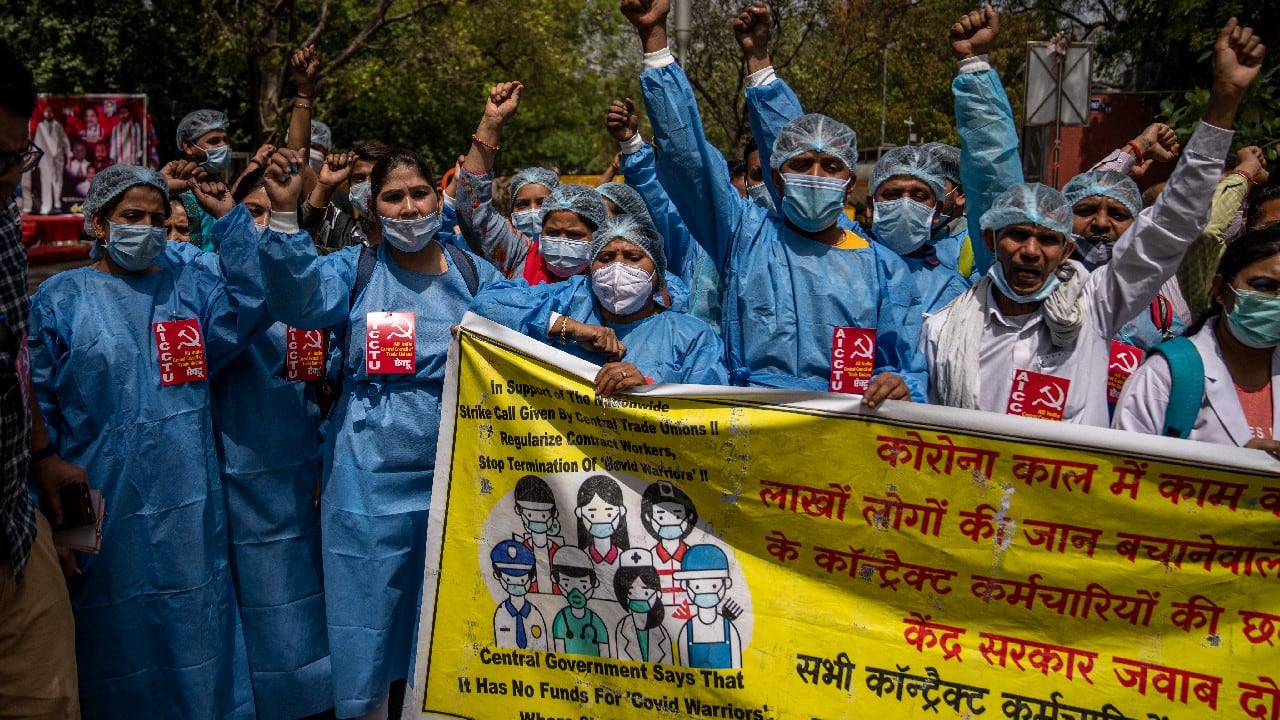 The demonstrators included contract health workers who wore protective robes and demanded increased wages and regulation of their services. (Image: AP)
