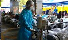 Outbreaks in China prompt lockdowns and fears of more economic woes