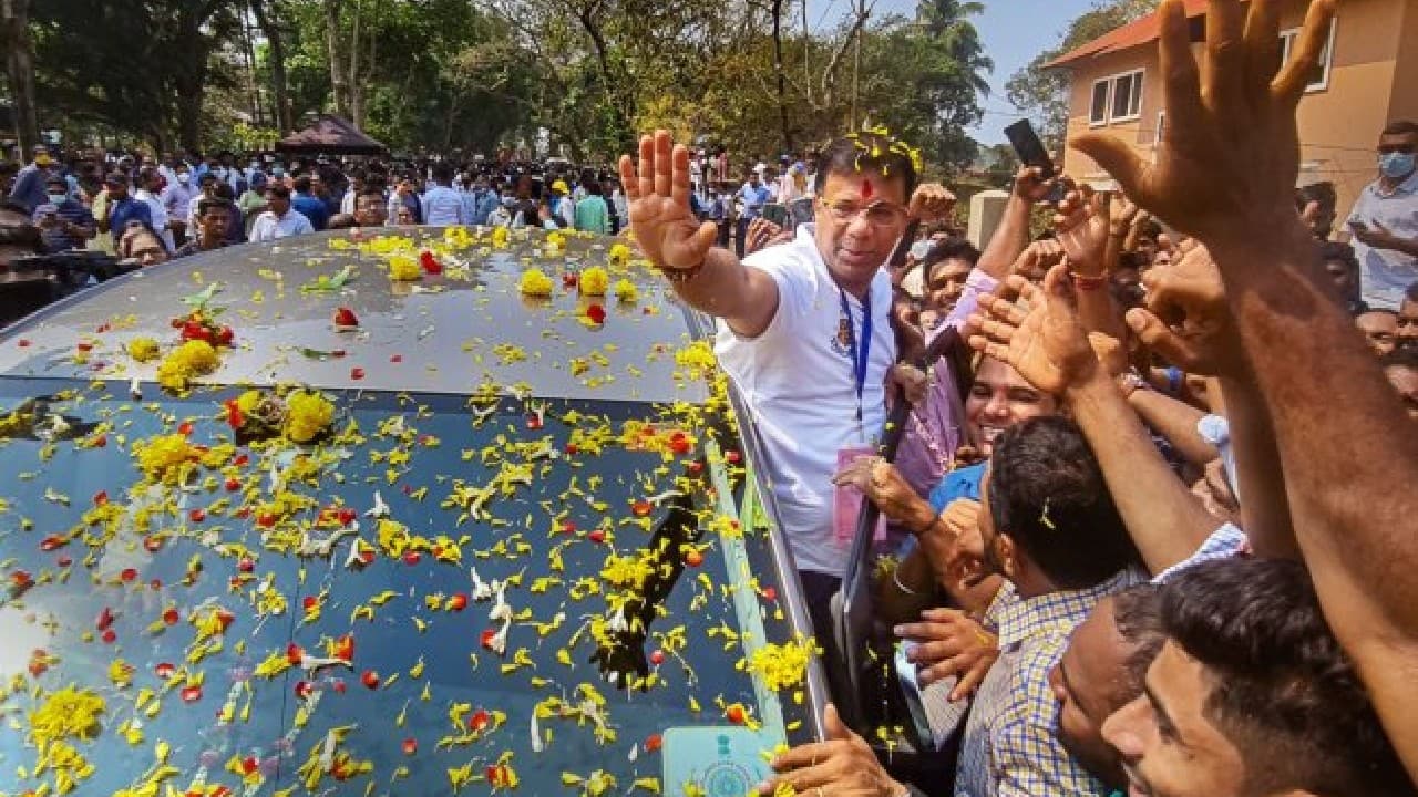 BJP leader Vishwajit Pratapsingh Rane greets supporters and party workers at a counting centre in Panaji during the counting day of Goa elections. (Image: PTI)
