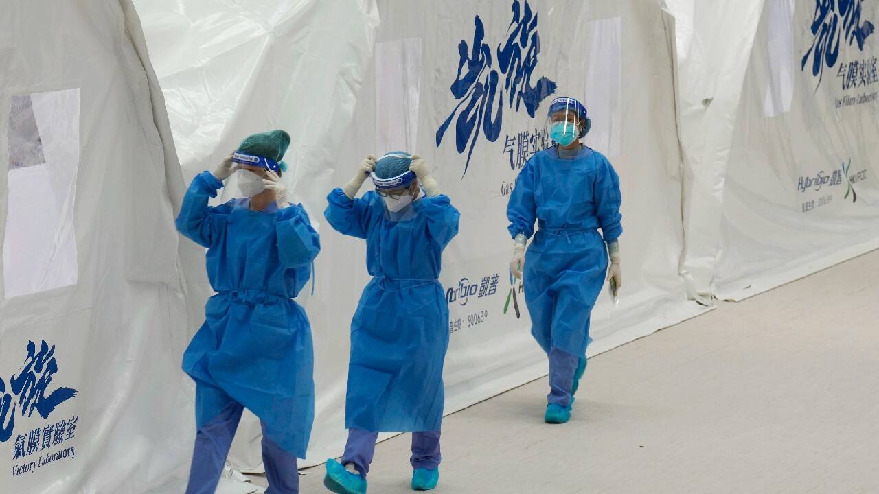 In Hong Kong, the plan is to test every resident three times. Authorities said they may restrict their movements to reduce the risk of transmission. Everyone testing positive must be admitted to a hospital or isolation facility, depending on the severity of symptoms. (Image: AP) In Hong Kong, the plan is to test every resident three times. Authorities said they may restrict their movements to reduce the risk of transmission. Everyone testing positive must be admitted to a hospital or isolation facility, depending on the severity of symptoms. (Image: AP)