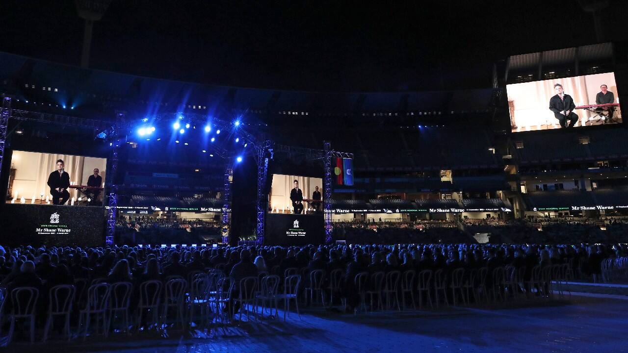 John and fellow British musicians Ed Sheeran, Robbie Williams and Coldplay frontman Chris Martin appeared on a large screen via video. So too did Australian singers (and sisters) Kylie and Dannii Minogue. (Image: AP) John and fellow British musicians Ed Sheeran, Robbie Williams and Coldplay frontman Chris Martin appeared on a large screen via video. So too did Australian singers (and sisters) Kylie and Dannii Minogue. (Image: AP)