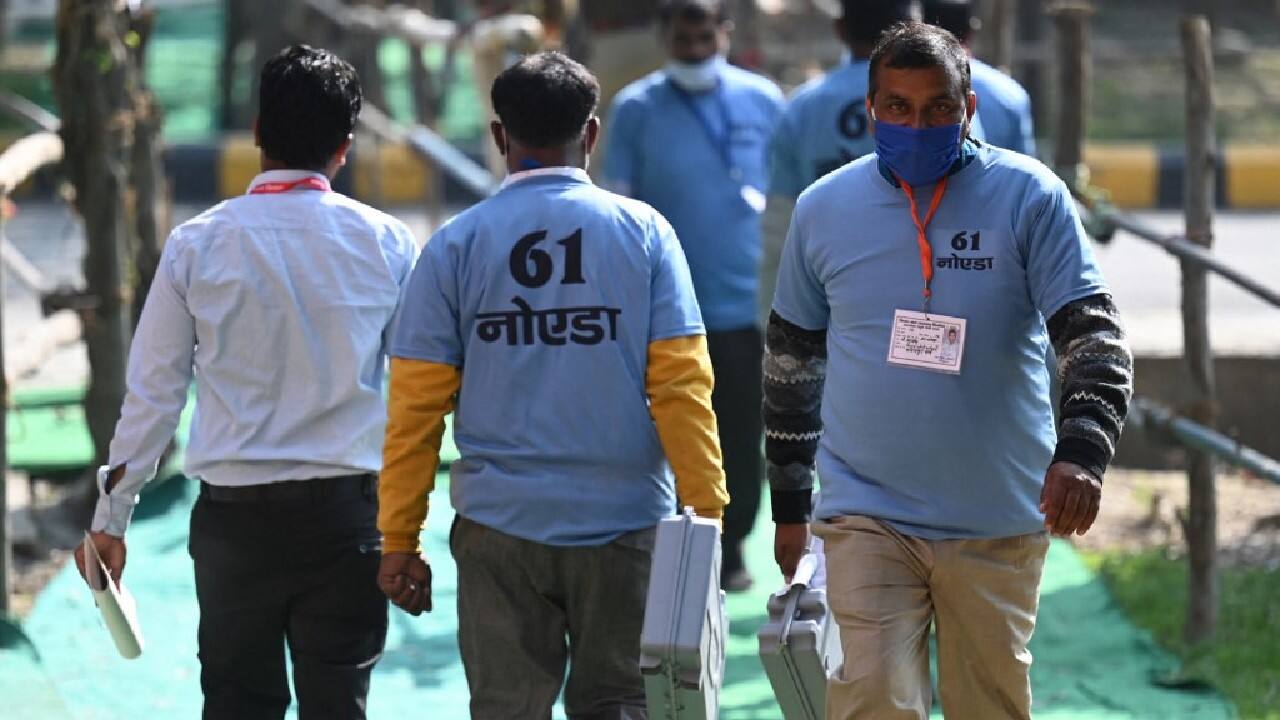 Electoral officials hold Electronic Voting Machines (EVM) at a counting center of the Uttar Pradesh state assembly election votes in Noida. (Image: AFP) Electoral officials hold Electronic Voting Machines (EVM) at a counting center of the Uttar Pradesh state assembly election votes in Noida. (Image: AFP)