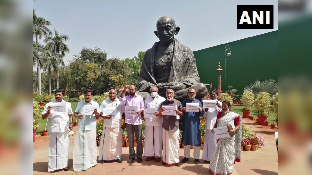 Left and DMK MPs protest at Gandhi statue in Delhi over the two-day 'Bharat Bandh' called central trade unions. (Image: Twitter @ANI) Left and DMK MPs protest at Gandhi statue in Delhi over the two-day 'Bharat Bandh' called central trade unions. (Image: Twitter @ANI)