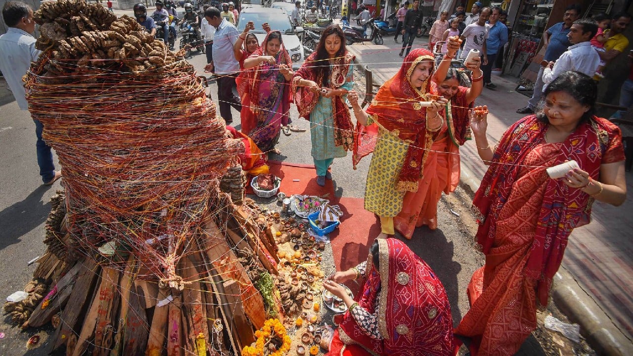 Devotees perform rituals during 'Holika Dahan' on the eve of Holi festival, in Patna, March 17. (Image: PTI)