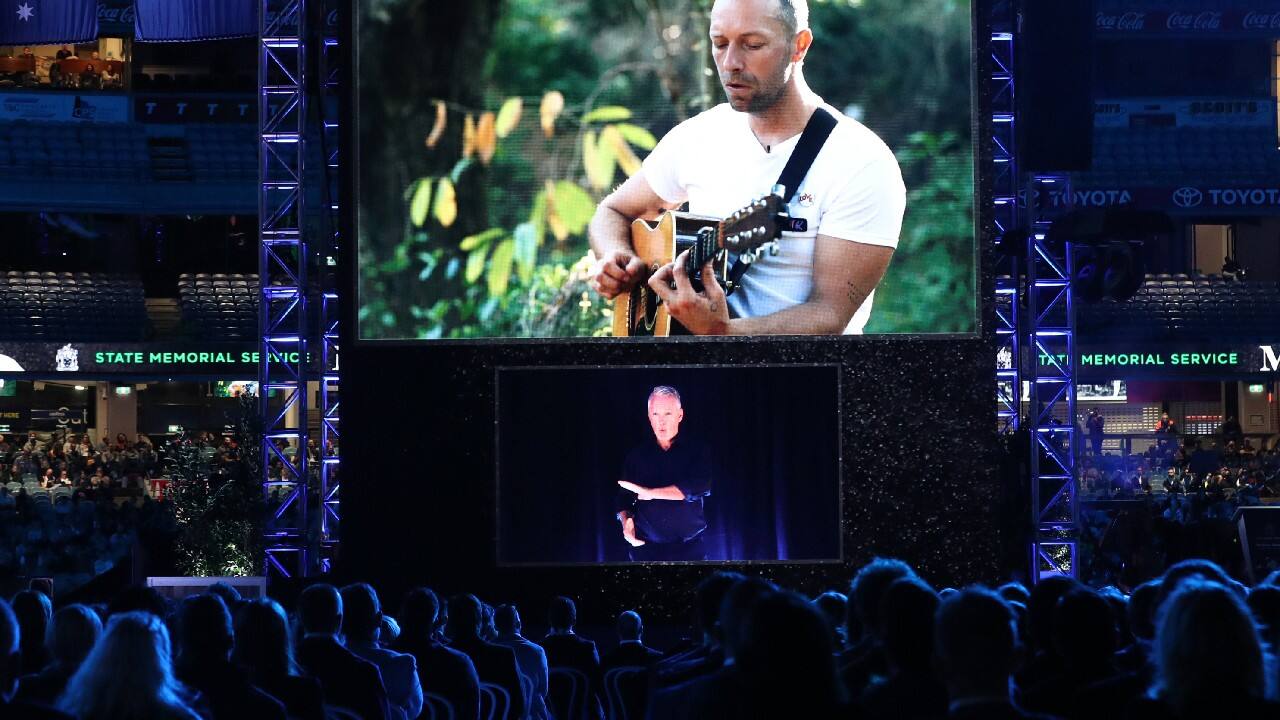 Martin played “Eulogy,” a piano piece that he composed for the occasion. In another video, Martin apologized for not attending the memorial in person. “We’re on tour in Central America and there are a lot of background noises, but I feel like that might be OK with him,” Martin said in a jungle setting. “I think chaos and Shane were good friends,” Martin added before performing “Yellow” with a guitar. (Image: AP) Martin played “Eulogy,” a piano piece that he composed for the occasion. In another video, Martin apologized for not attending the memorial in person. “We’re on tour in Central America and there are a lot of background noises, but I feel like that might be OK with him,” Martin said in a jungle setting. “I think chaos and Shane were good friends,” Martin added before performing “Yellow” with a guitar. (Image: AP)