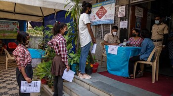 Children wait in line to register themselves for COVID-19 vaccine at a health centre in New Delhi, March 16. (Image: AP)
