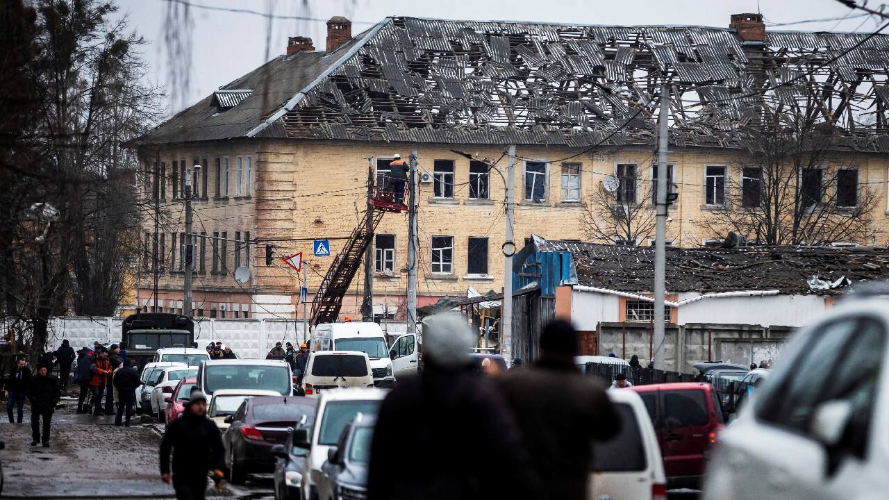 Locals walk next to a building damaged by shelling, as Russia's invasion of Ukraine continues, in Zhytomyr, Ukraine March 2. (Image: Reuters) Locals walk next to a building damaged by shelling, as Russia's invasion of Ukraine continues, in Zhytomyr, Ukraine March 2. (Image: Reuters)