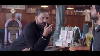 Jaideep Ahlawat (left) as Jaggi Grover and Zeshan Ayyub as Daljeet Grover in 'Bloody Brothers', streaming on Zee5. (Image: Screen grab)