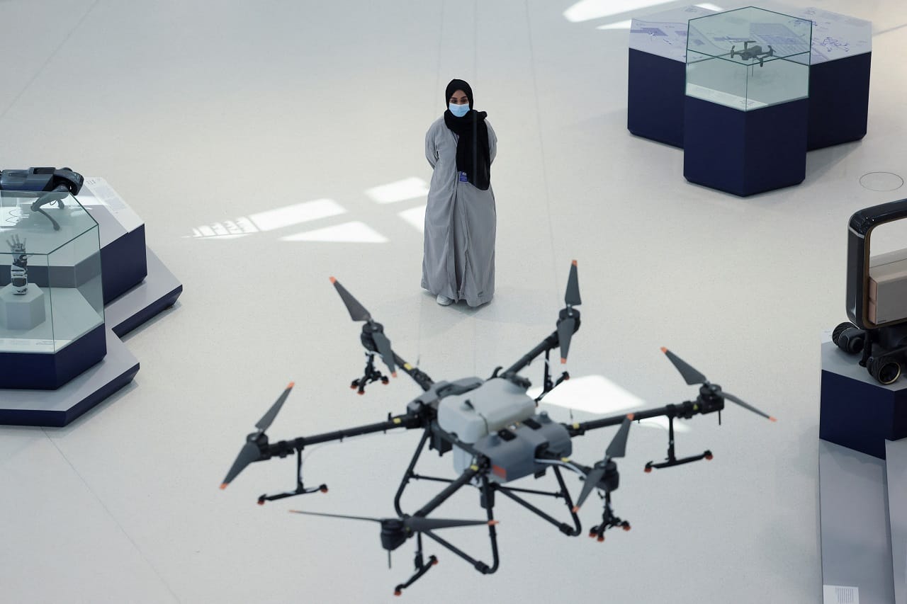 A member of the museum staff stands near an unmanned aerial vehicle (UAV) (Image: Reuters)
