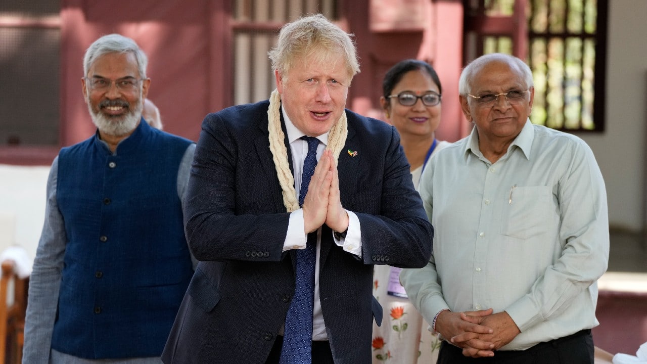 British Prime Minister Boris Johnson visits Sabarmati Ashram in Ahmedabad on April 21 during his two-day visit to India that will see him meet Prime Minister Narendra Modi in New Delhi on April 22. (Image: AP)