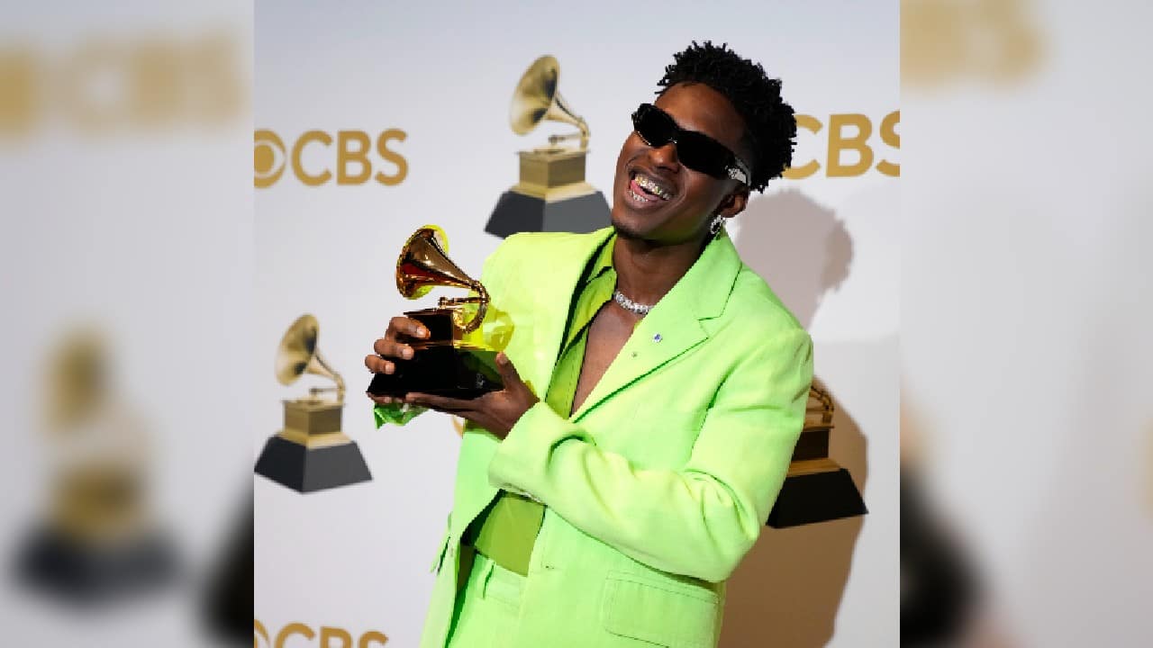 Lucky Daye, winner of the award for best progressive R&amp;B album for &quot;Table For Two,&quot; poses in the press room at the 64th Annual Grammy Awards. (Image: AP)
