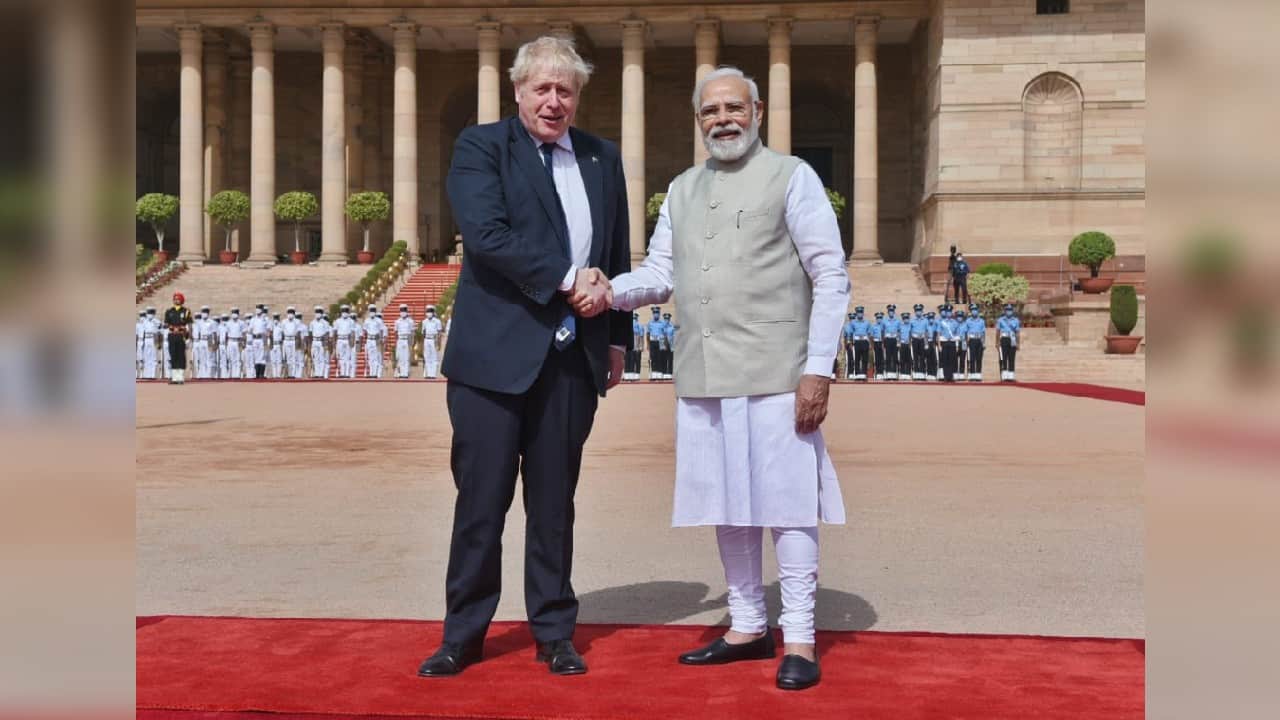 British Prime Minister Boris Johnson waves with Narendra Modi at India's presidential palace Bhavan in New Delhi. (Image: Twitter @MEAIndia) British Prime Minister Boris Johnson waves with Narendra Modi at India's presidential palace Bhavan in New Delhi. (Image: Twitter @MEAIndia)