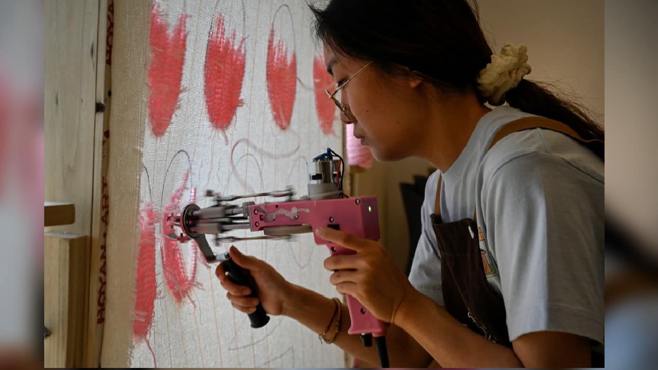 There are now more than 140 tufting workshops in Beijing alone, according to booking site Dianping. But the challenge is getting repeat customers, Mao Wei, the owner of Horus Club tufting workshop told AFP. Many are just one-time visitors who "come out of curiosity", he said. (Source: AFP) There are now more than 140 tufting workshops in Beijing alone, according to booking site Dianping. But the challenge is getting repeat customers, Mao Wei, the owner of Horus Club tufting workshop told AFP. Many are just one-time visitors who "come out of curiosity", he said. (Source: AFP)
