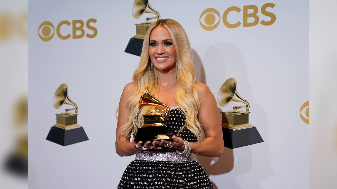 Carrie Underwood, winner of the award for best roots gospel album for &quot;My Savior,&quot; poses in the press room at the 64th Annual Grammy Awards. (Image: AP)