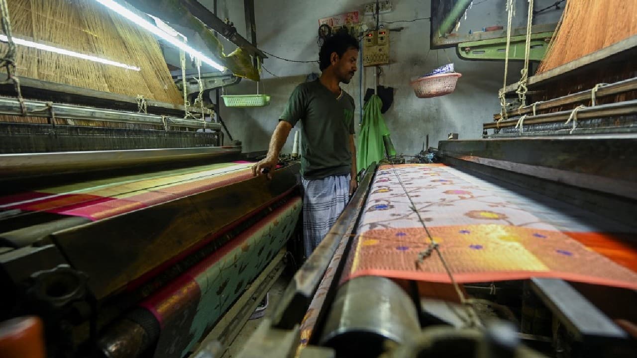 His neighbours have all switched to electric looms for their garments, which lack the subtleties of hand-woven textiles and sell for just a third of the price but take a fraction of the time to finish. (Image: AFP)
