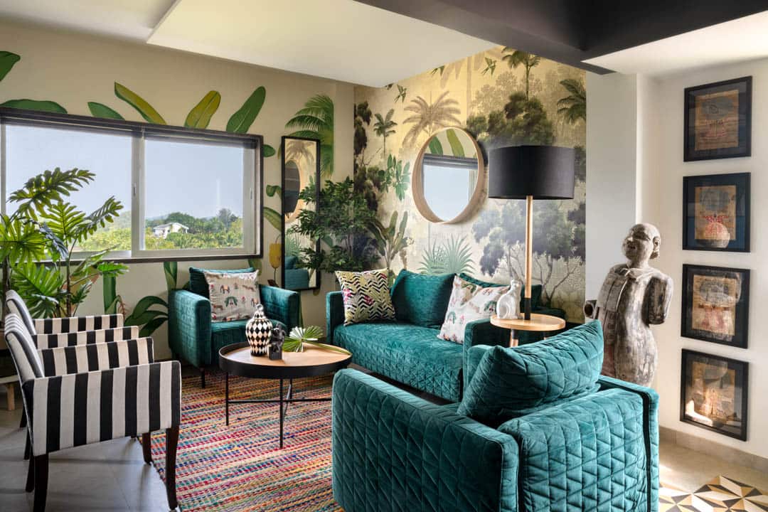 The smaller living-seating area has a two-seater emerald green velvet couch with a couple of chairs for intimate gatherings. (Photo courtesy Fabien Charuau)