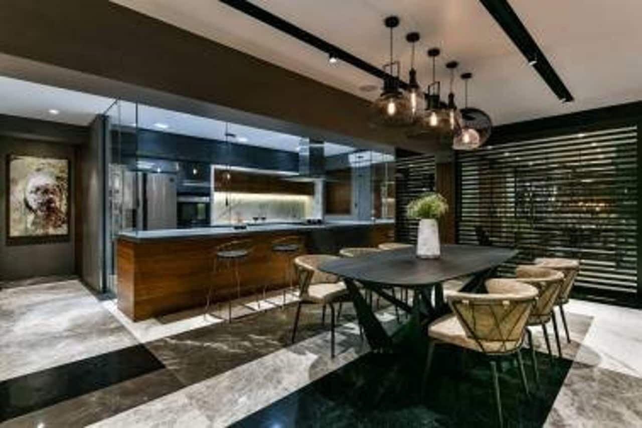 As homes get smaller, designers are veering towards more open plans and the distinction between the kitchen area and living spaces is fading.
