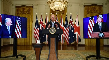 US President Joe Biden participates is a virtual press conference on national security with British Prime Minister Boris Johnson (R) and Australian Prime Minister Scott Morrison in the East Room of the White House in Washington, DC, on September 15, 2021.  Photographer: Brendan Smialowski/AFP/Getty Images