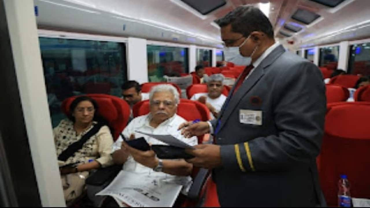 A checker checking a ticket of the passengers.