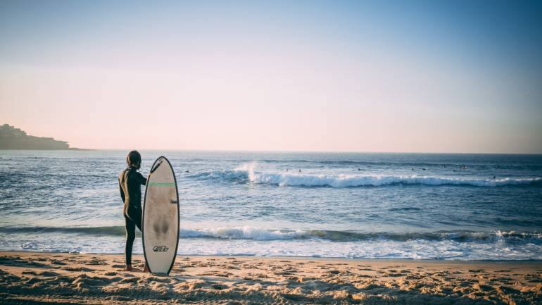 While in Sydney, Australia, go surfing at Bondi Beach. (Image: Alex King via Unsplash)