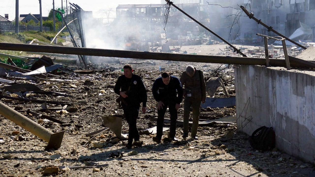 People walk at a site of a shopping centre destroyed by shelling amid Russia's invasion of Ukraine, in Odesa, Ukraine, May 10. (Image: Reuters) People walk at a site of a shopping centre destroyed by shelling amid Russia's invasion of Ukraine, in Odesa, Ukraine, May 10. (Image: Reuters)