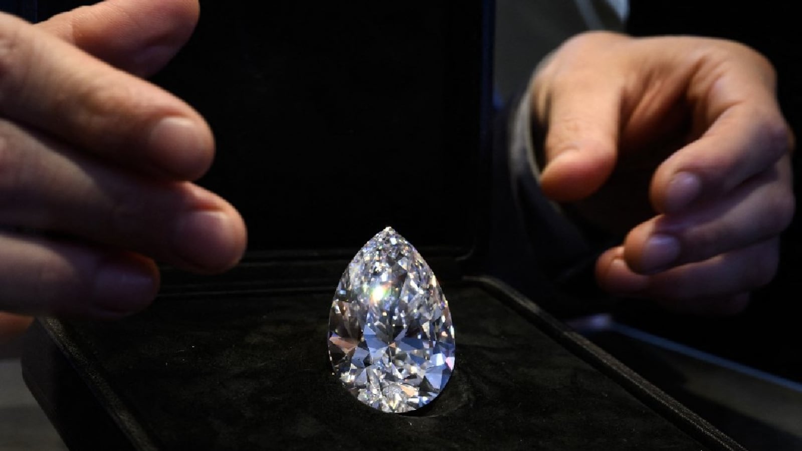 Biggest white diamond ever: 'The Rock' auction fetches $21.9 million