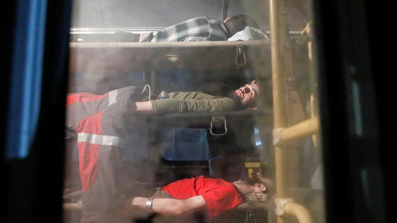 A bus carrying wounded service members of Ukrainian forces from the besieged Azovstal steel mill in Mariupol drives under escort of the pro-Russian military in the course of Ukraine-Russia conflict upon arrival in Novoazovsk, Ukraine May 16. (Image: Reuters)