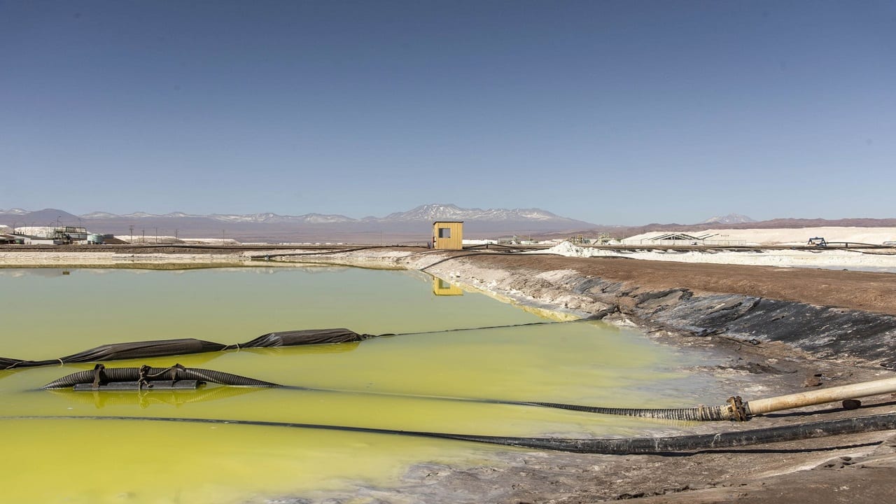 Pipes pump brine from a pool at an Albemarle mine in Chile. Photographer: Cristobal Olivares/Bloomberg