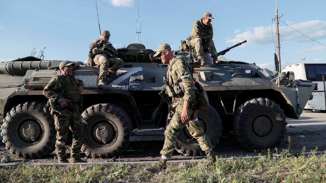 Service members of pro-Russian troops wait before the expected evacuation of wounded Ukrainian soldiers from the besieged Azovstal steel mill in the course of Ukraine-Russia conflict in Mariupol, Ukraine May 16. (Image: Reuters)