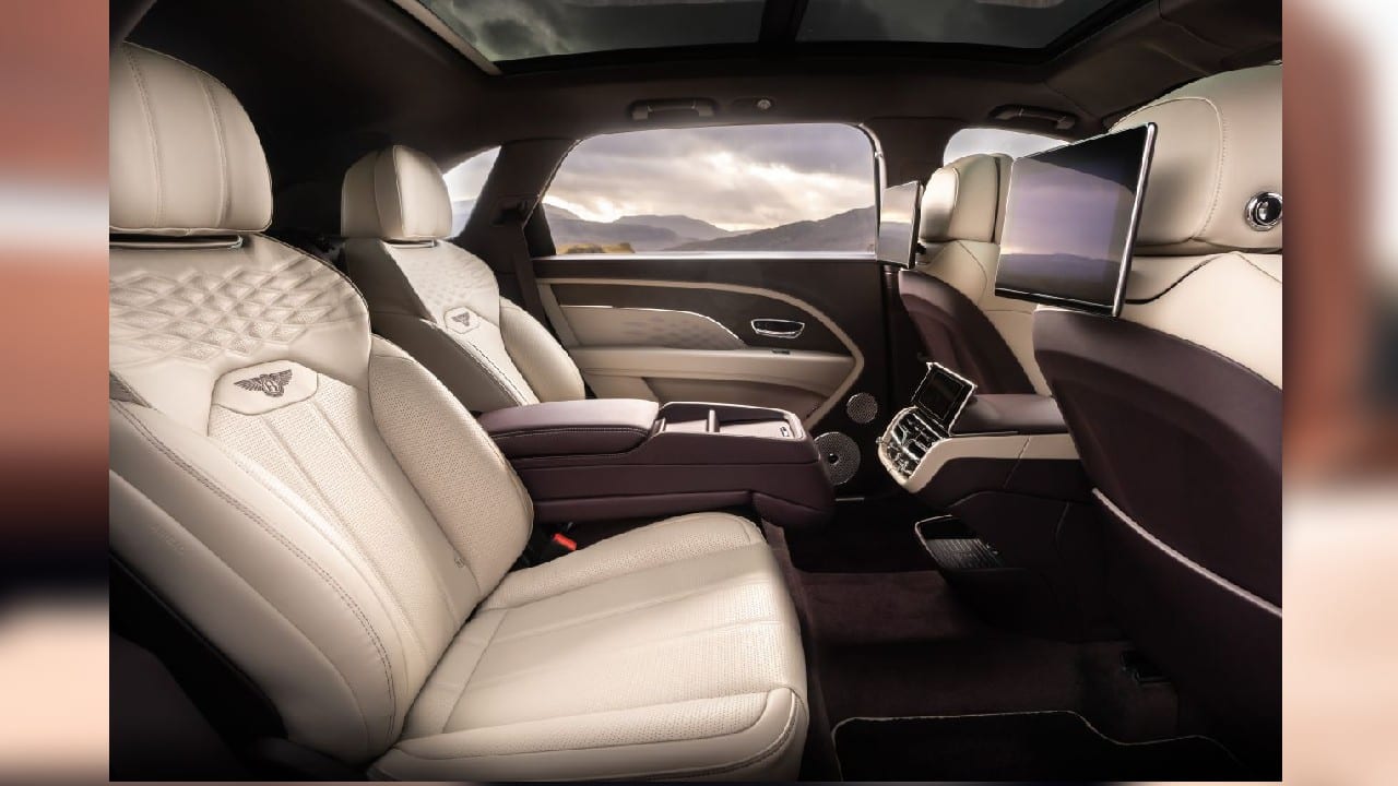 Over on the inside is where the luxury really begins. As we mentioned before, the length of the cabin has increased by 180 mm and almost all of this increase is concentrated on the rear. However, unlike the standard Bentayga, the EWB does not come with a seven seat option. What it does get, however, are three other seat options. There’s the normal ‘Comfort Specification’ four- and five-seater with foldable backrests. There is also a specification called ‘4+1’. In this specification, the two outer seats get a boat-load of features, including 16-way electric adjustability, heating, ventilation and even five massage programmes. The middle seat, on the other hand, can hold one person, but the back rest can be folded down to access the ski hatch. (Image Source: Bentley)