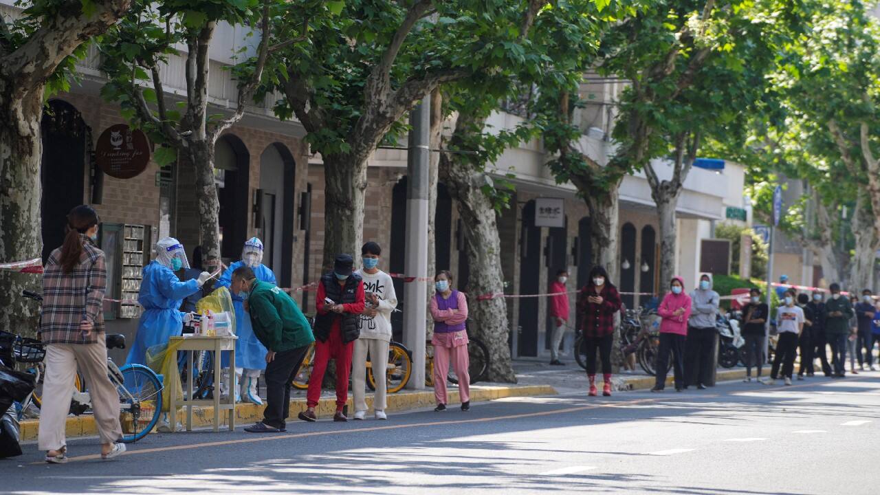 Residents line up for nucleic acid tests during lockdown, amid the coronavirus outbreak, in Shanghai, China, May 4. (Image: Reuters)