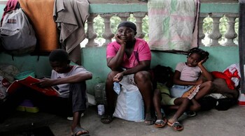 People stay in a school that serves as a shelter after two weeks of turf wars between rival gangs have forced residents to flee their homes, in Tabarre municipality, Haiti May 14, 2022 (Reuters/Ralph Tedy Erol)
