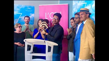 India at Cannes: ‘All That Breathes’ director Shaunak Sen accepts the L'Oeil d'or prize at Cannes. (Image credit: @AnuragThakur/Twitter)