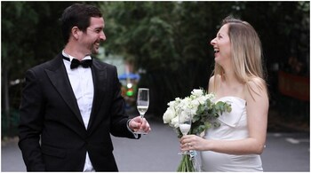 Matthew Mitchener with bride Janelle Nuyts celebrating their wedding in the car park of their housing compound during lockdown in Shanghai.
