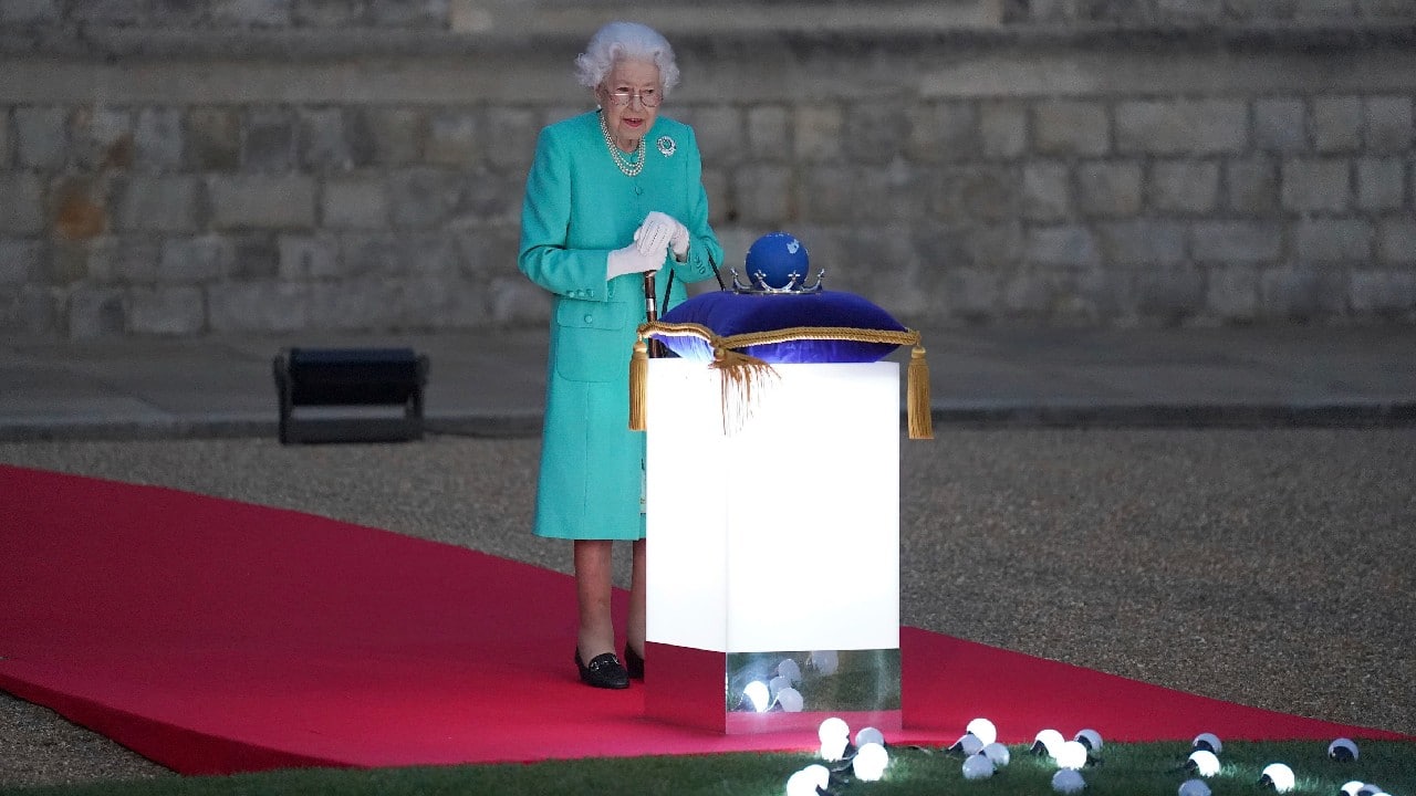 The queen was presented with a &quot;Commonwealth of Nations Globe&quot; at a ceremony in the grounds of her Windsor Castle residence which she pressed to trigger the start of beacon lighting across the UK. (Image: AP)
