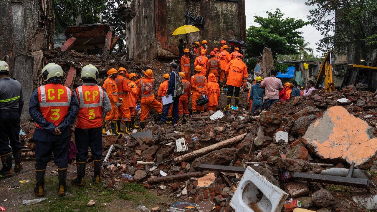 Dozens of rescuers were clearing the debris to find residents still trapped, news agency Press Trust of India reported, quoting government administrator Pravina Morajkar. (Source: AP)