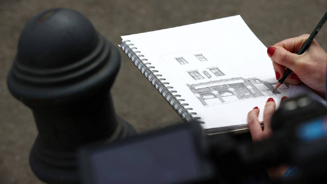 A few days later, Wood is in busy Soho to draw a very different pub, The Coach and Horses on Greek Street, which she has been into before. &quot;When you've been inside the pub you kind of have a connection to it,&quot; she said. She chose the pub because a commentator on one of her TikTok videos told her of a family connection to the pub. Their grandfather, Norman Balon, was famously known as &quot;London's rudest landlord&quot; and ran the pub for more than 60 years. &quot;I loved that sort of anecdote,&quot; said Wood. &quot;It immediately drew me towards it.&quot; (Image: AFP)