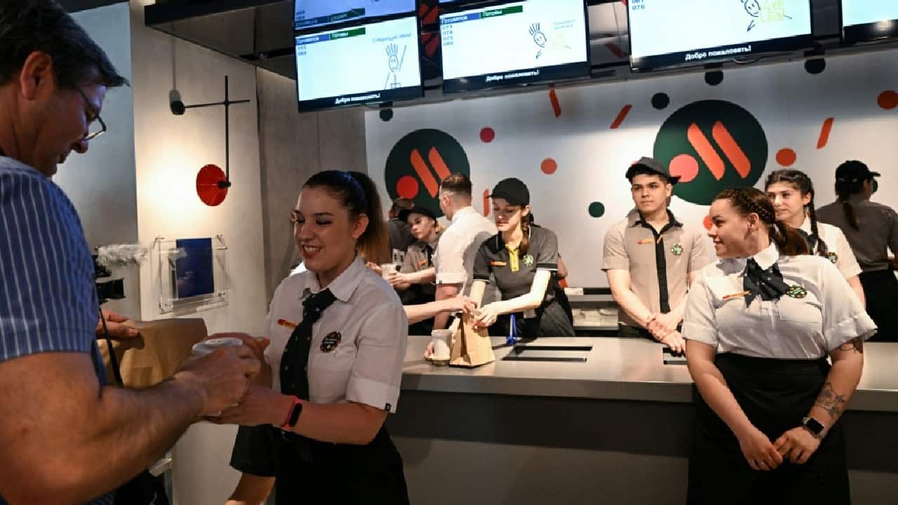 In place of the Golden Arches, there's a new logo – two stylised orange fries alongside a red dot on a green background. There are still double cheeseburgers on the menu, as well as a wide range of ice creams and desserts. But the &quot;Mc&quot; prefix no longer appears. (Image: AFP)
