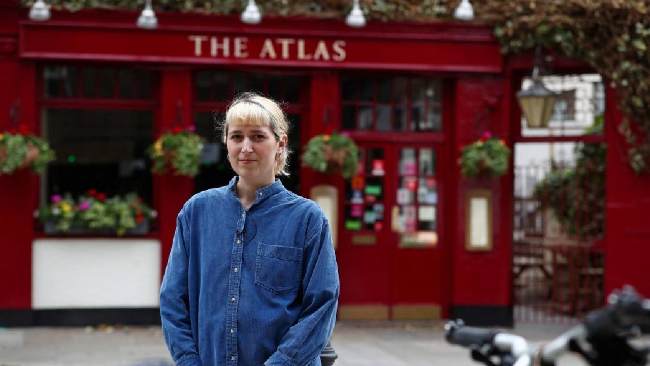 The Atlas pub, near Earl's Court, was suggested by a TikTok follower and sits on a quiet side street near a leafy cemetery. But Wood still has to put up with screeching ambulances driving past and a plumber's van unhelpfully parking in front of the building. Some publicans have given her a hearty welcome when they realised she was drawing their buildings. But The Atlas, its bricks painted glossy red and the upper walls covered with creeper vines, is closed until late afternoon. (Image: AFP)