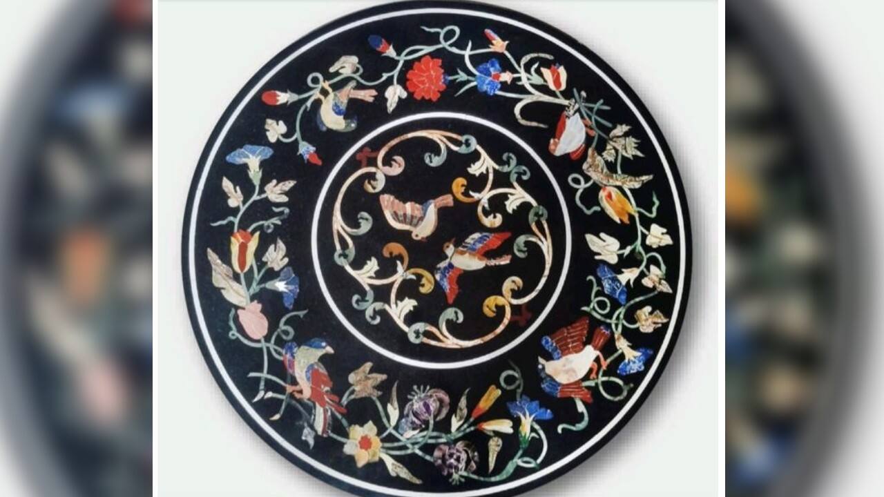 PM Modi gifted a &lsquo;marbel inlay table top&rsquo; to Italy&rsquo;s PM Mario Draghi. Pietra dura or marble inlay has its origin in the Opus sectile - a form of pietra dura popularized in the ancient and medieval Roman world where materials were cut and inlaid into walls and floors to make a picture or pattern. This particular table top is made of semi-precious stones with gradients in their colour, making it very similar to Italian marble inlay work. (Source: ANI)