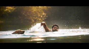 Actor Rakshit Shetty as Dharma and Charlie in '777 Charlie'. (Image: Screen grab)