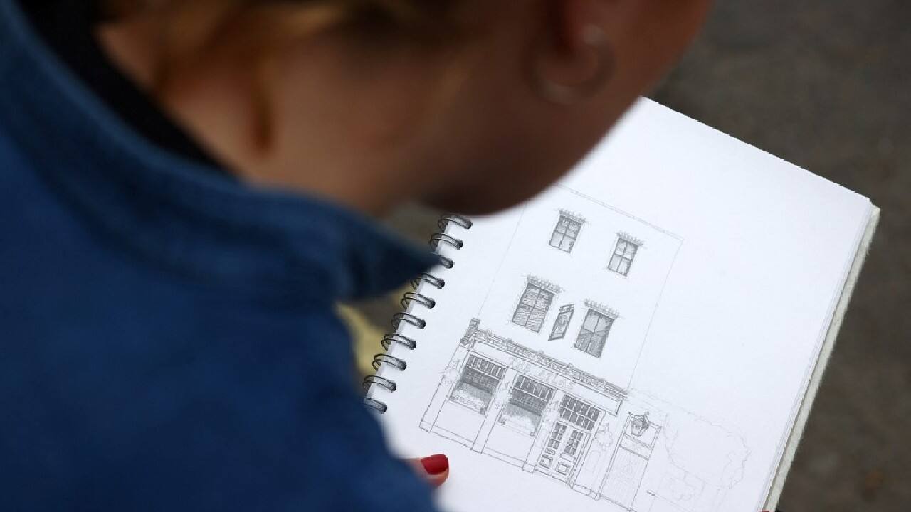 Now creating art is her full-time job, mostly carrying out individual commissions, including pubs and houses. She also sells prints on the e-commerce craft site Etsy. &quot;They feel so quintessentially British. I think that whether you're a pub person or not, they're great buildings to look at or be in.&quot; (Image: AFP)